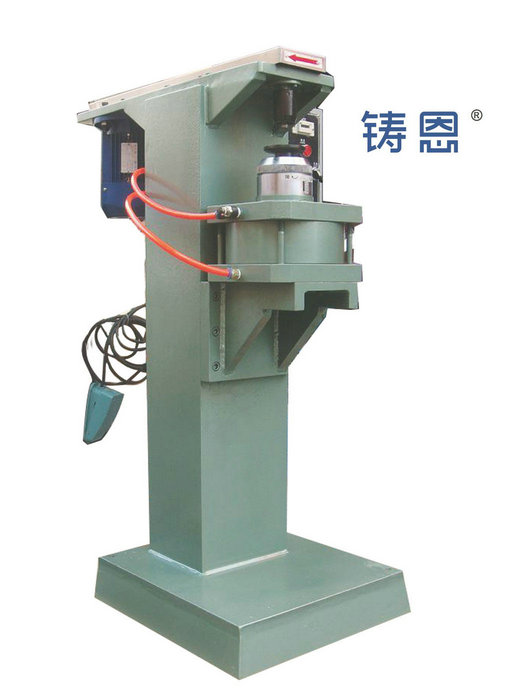 Pneumatic riveting machine